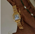 Montre Femme Ovale Dorée Bracelet Marron